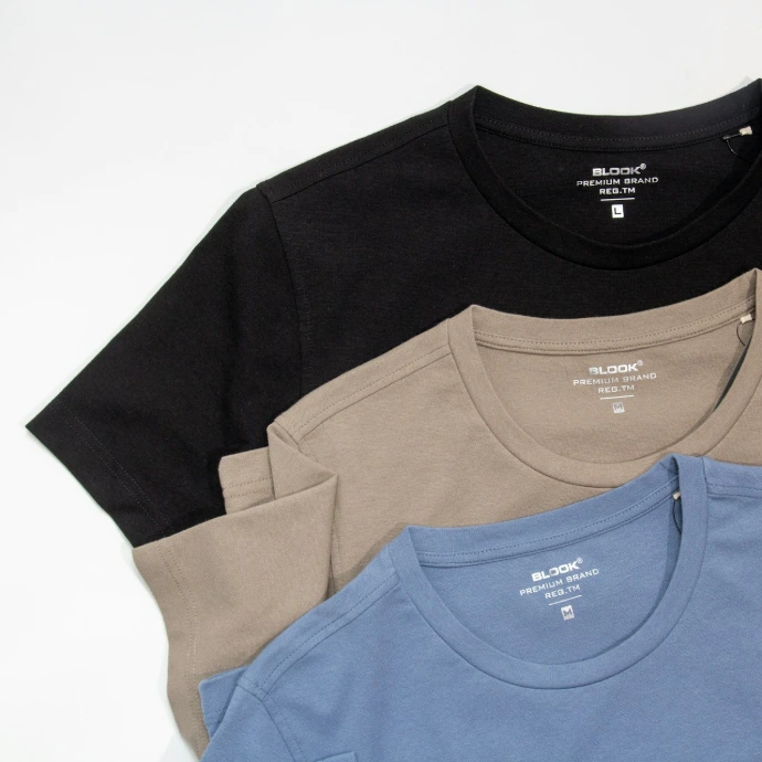 a group of three shirts sitting next to each other